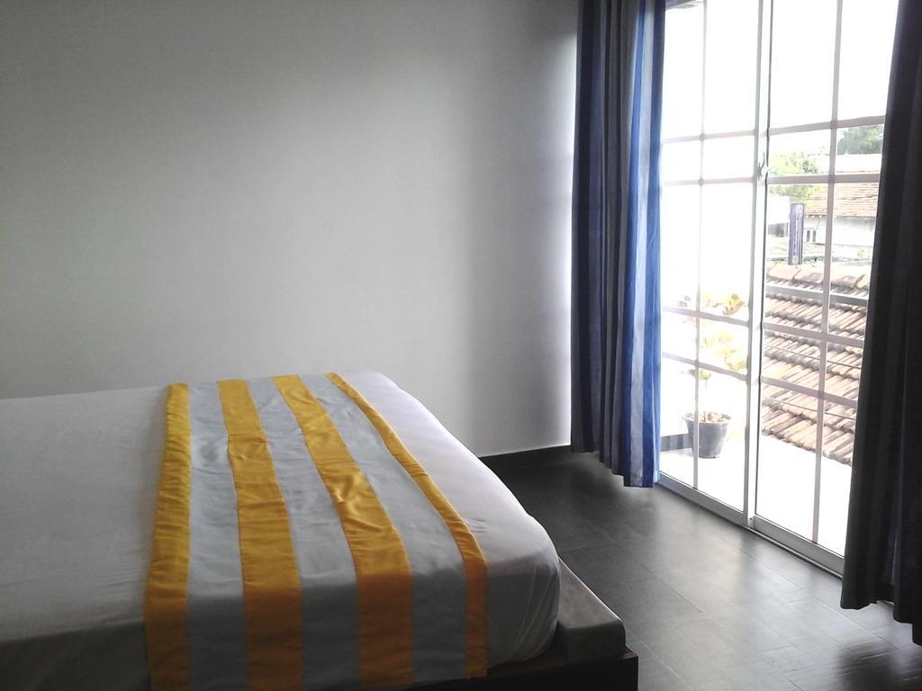 נגומבו Petit Guest House חדר תמונה