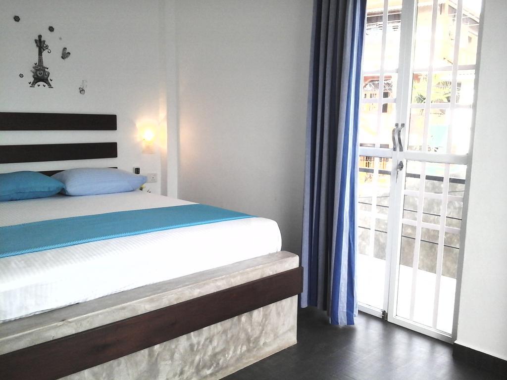 נגומבו Petit Guest House חדר תמונה